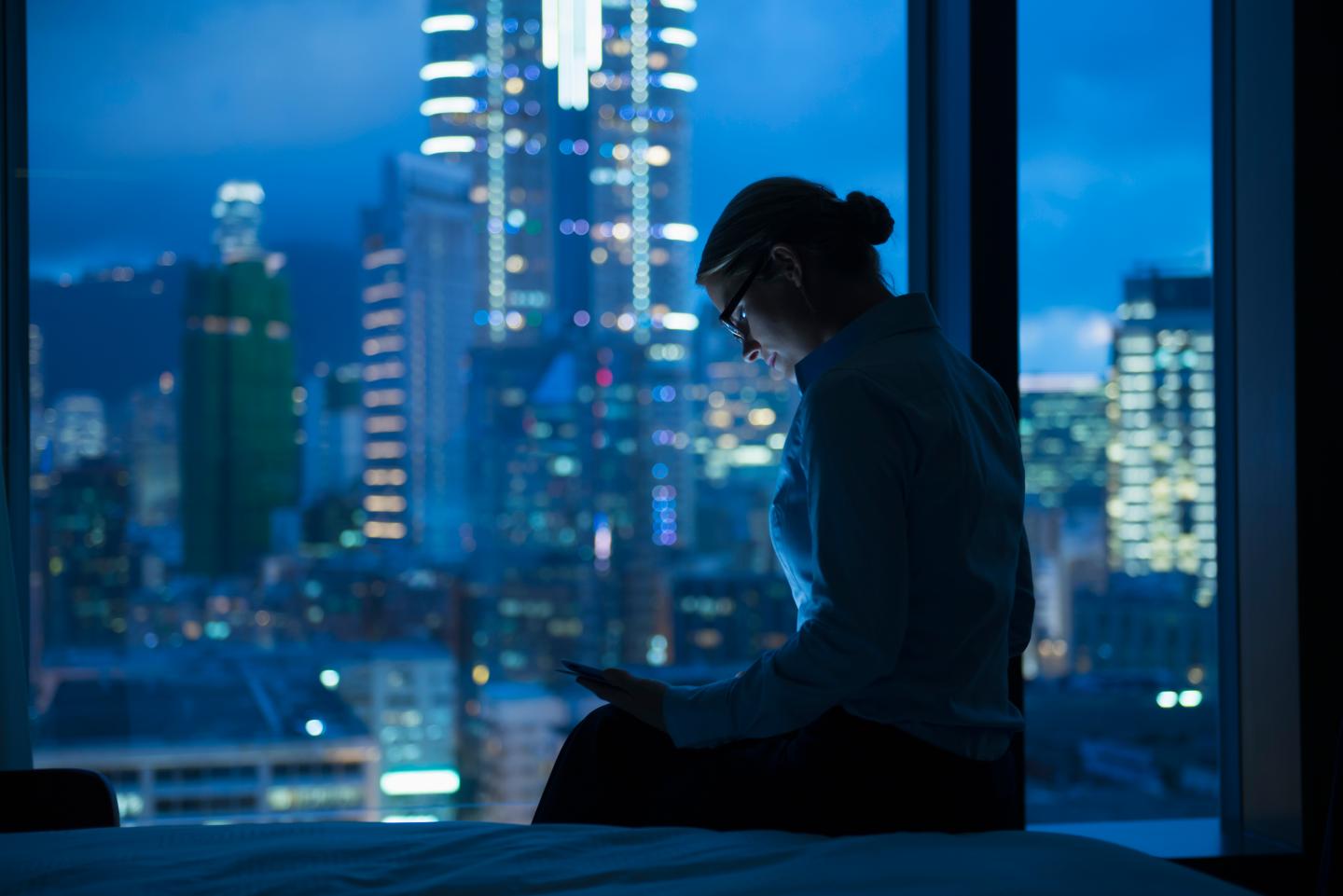 Caucasian businesswoman working late in office