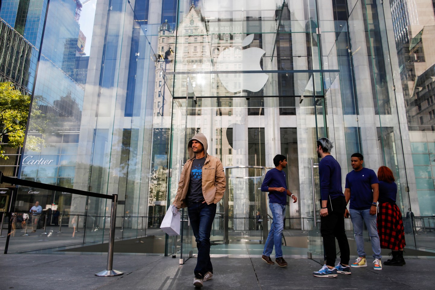 A customer exits the Apple Inc. store during the sale of the new iPhone 7 smartphone in New York, U.S.