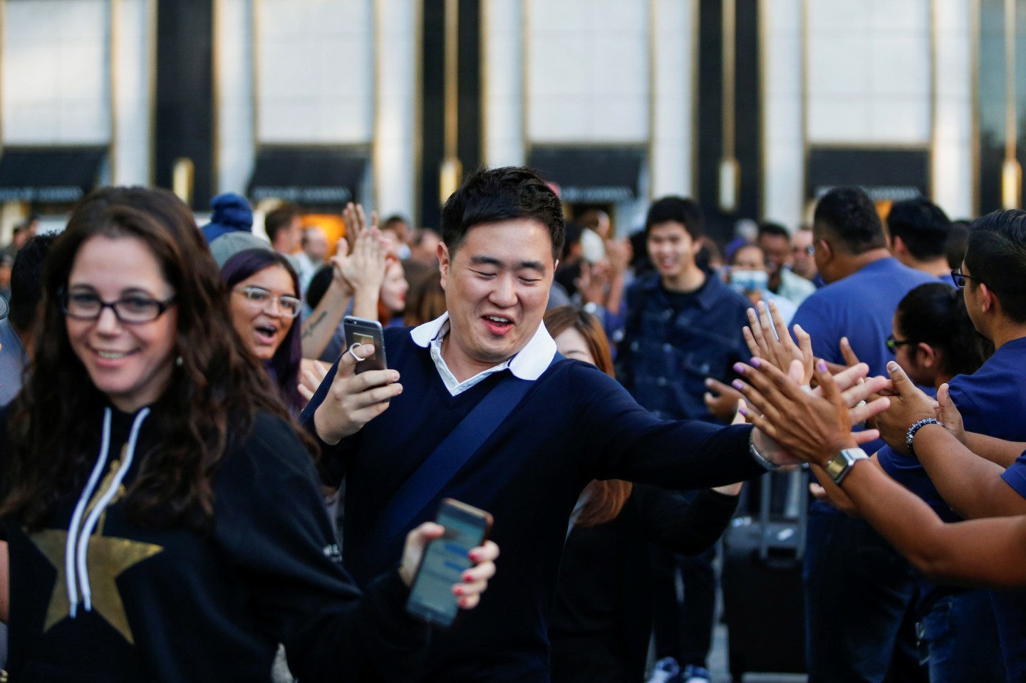 Customers go inside of an Apple Inc. store to buy the new iPhone 7 smartphone inside in New York, U.S
