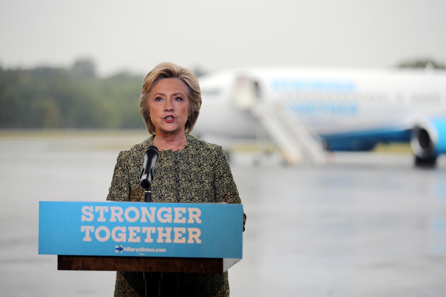 U.S. Democratic presidential candidate Hillary Clinton speaks to the media before boarding her campaign plane at the Westchester County airport in White Plains