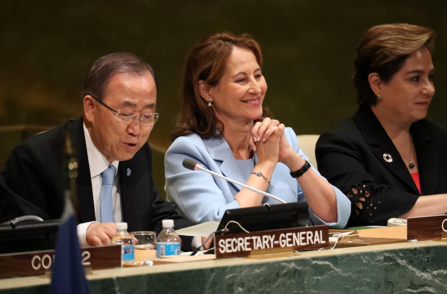 French Minister for Environment Segolene Royal sits with U.N. Secretary General Ban Ki-moon at United Nations headquarters in New York