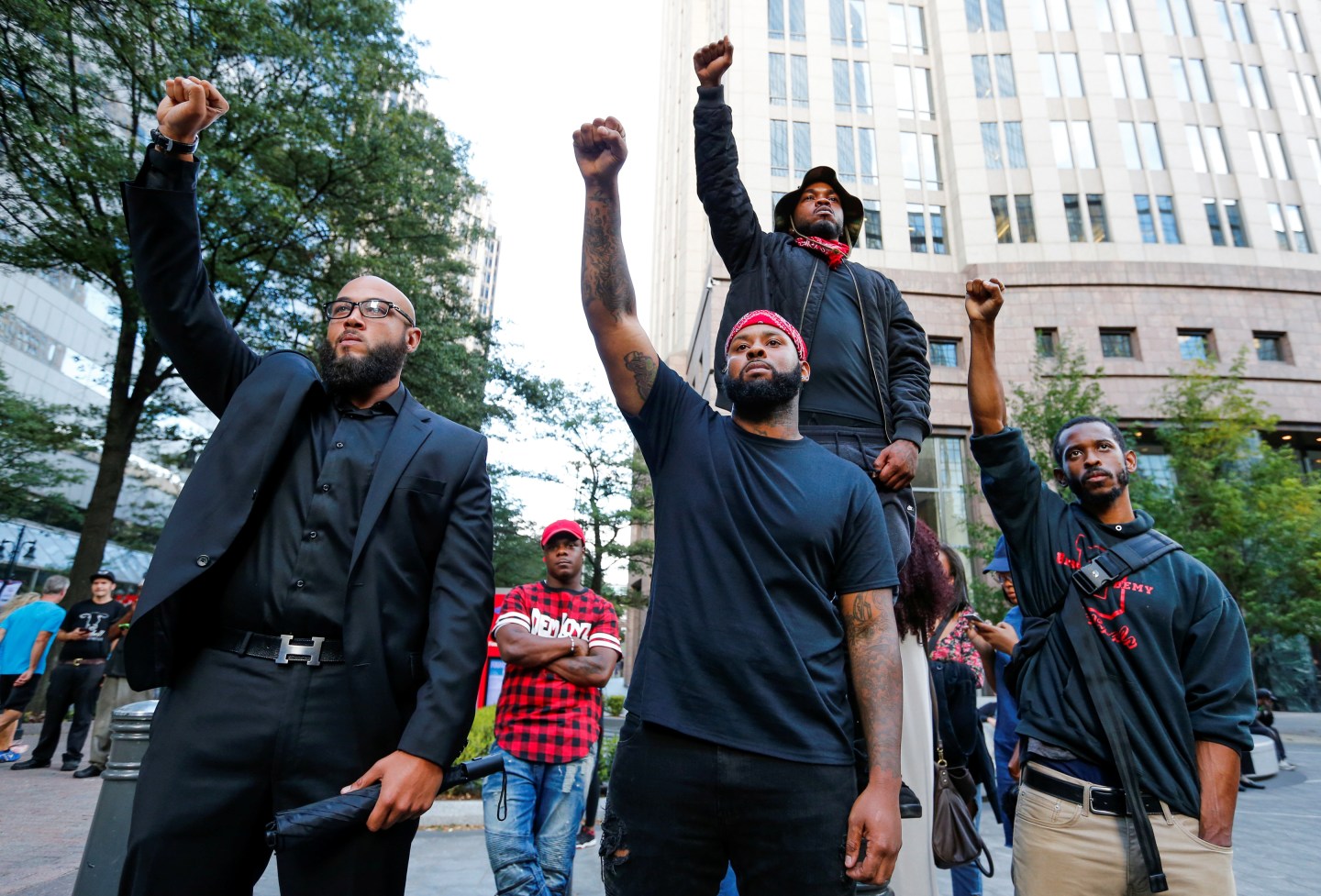 People gather at the intersection of Trade and Tryon Streets in uptown Charlotte, NC to protest the police shooting of Keith Scott, in Charlotte
