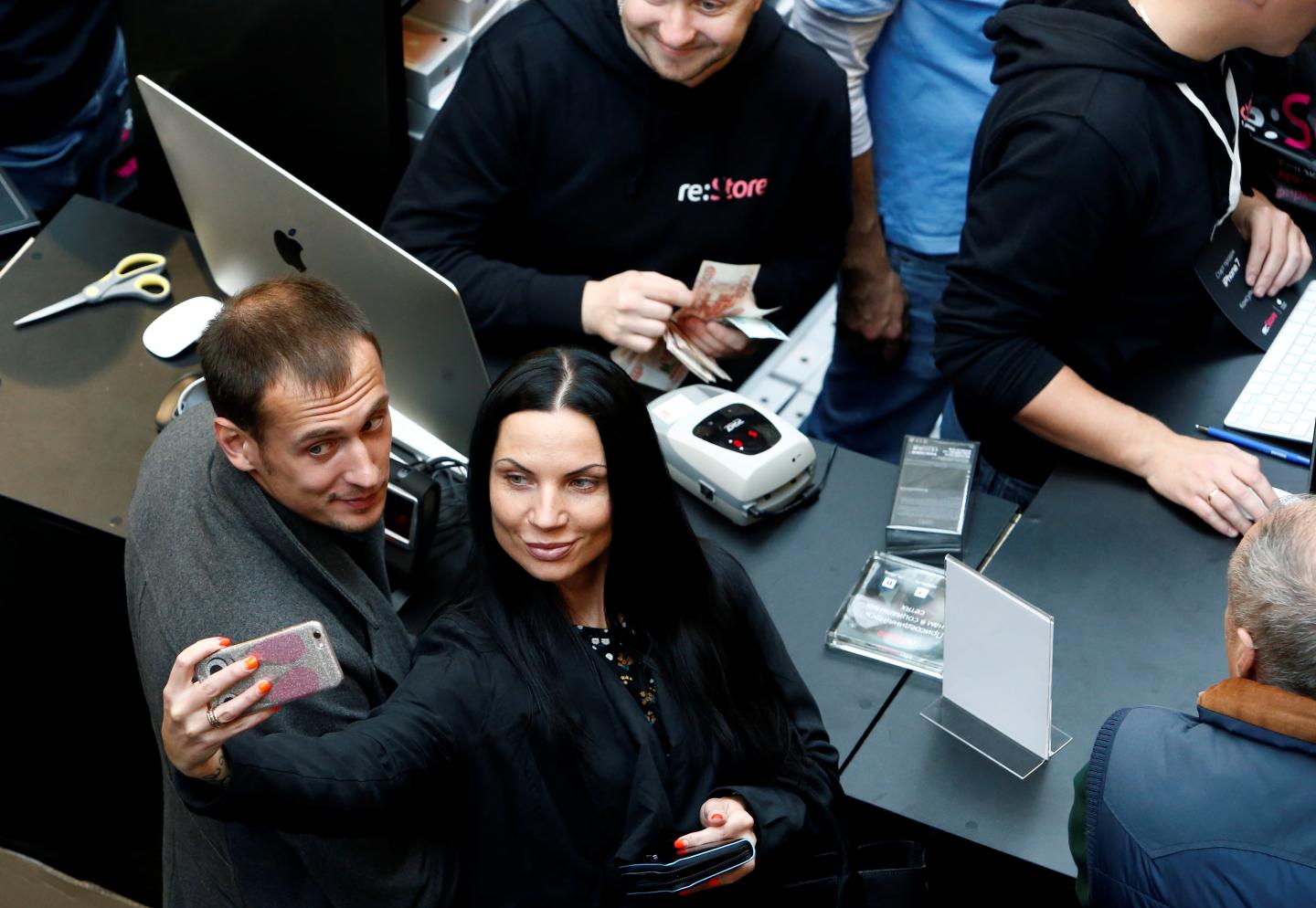 Customers gather at a store selling Apple products during launch of new iPhone 7 sales in Moscow