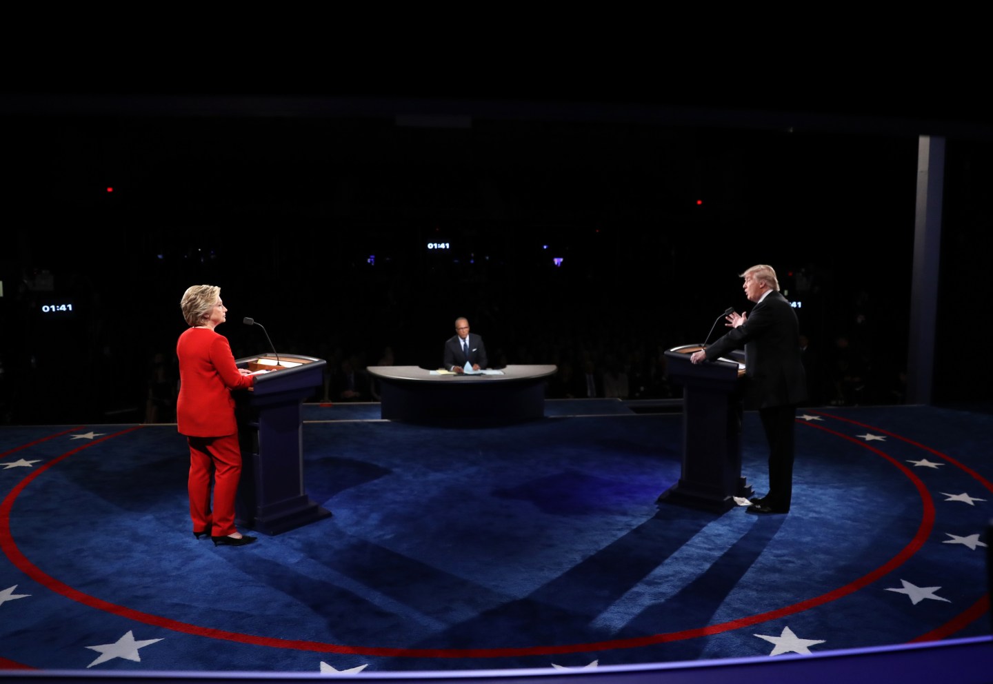 Republican U.S. presidential nominee Donald Trump speaks as Democratic U.S. presidential nominee Hillary Clinton listens during their first presidential debate at Hofstra University in Hempstead