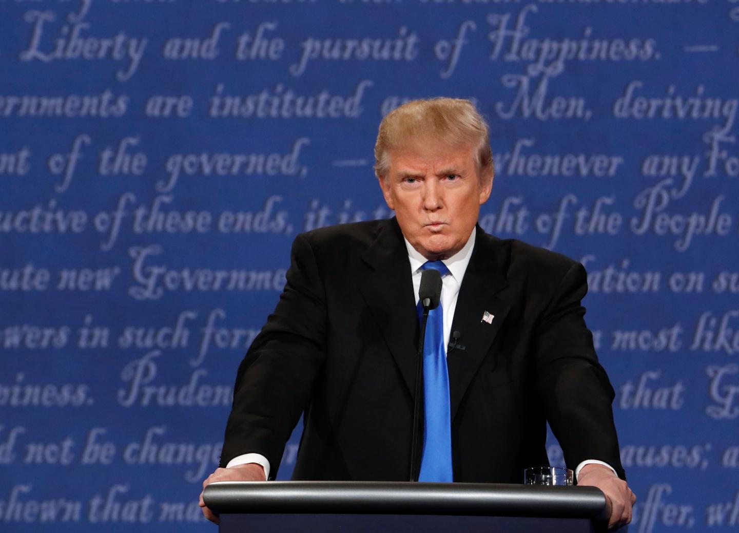 Republican U.S. presidential nominee Donald Trump reacts during first presidential debate at Hofstra University in Hempstead