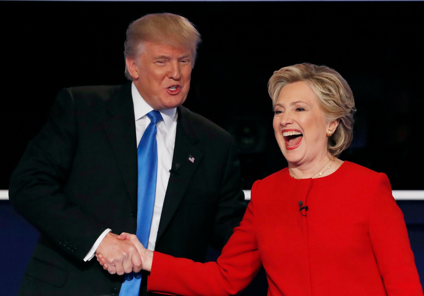 Republican U.S. presidential nominee Donald Trump shakes hands with Democratic U.S. presidential nominee Hillary Clinton at the conclusion of their first presidential debate at Hofstra University in Hempstead