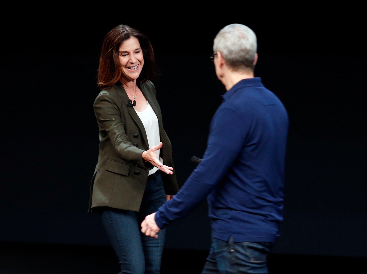 Susan Prescott is greeted by Tim Cook during an Apple media event in San Francisco