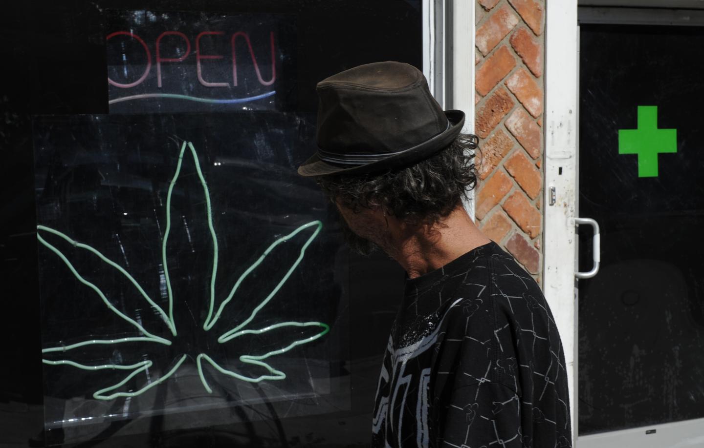 A man walks past a medicinal marijuana d