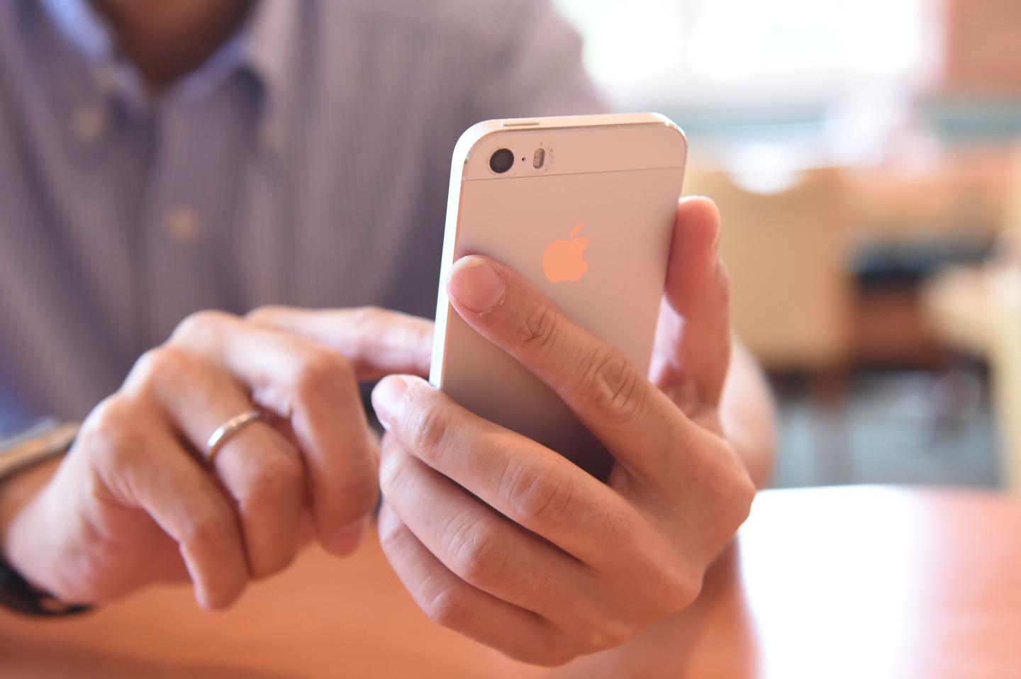 A man uses his smartphone.