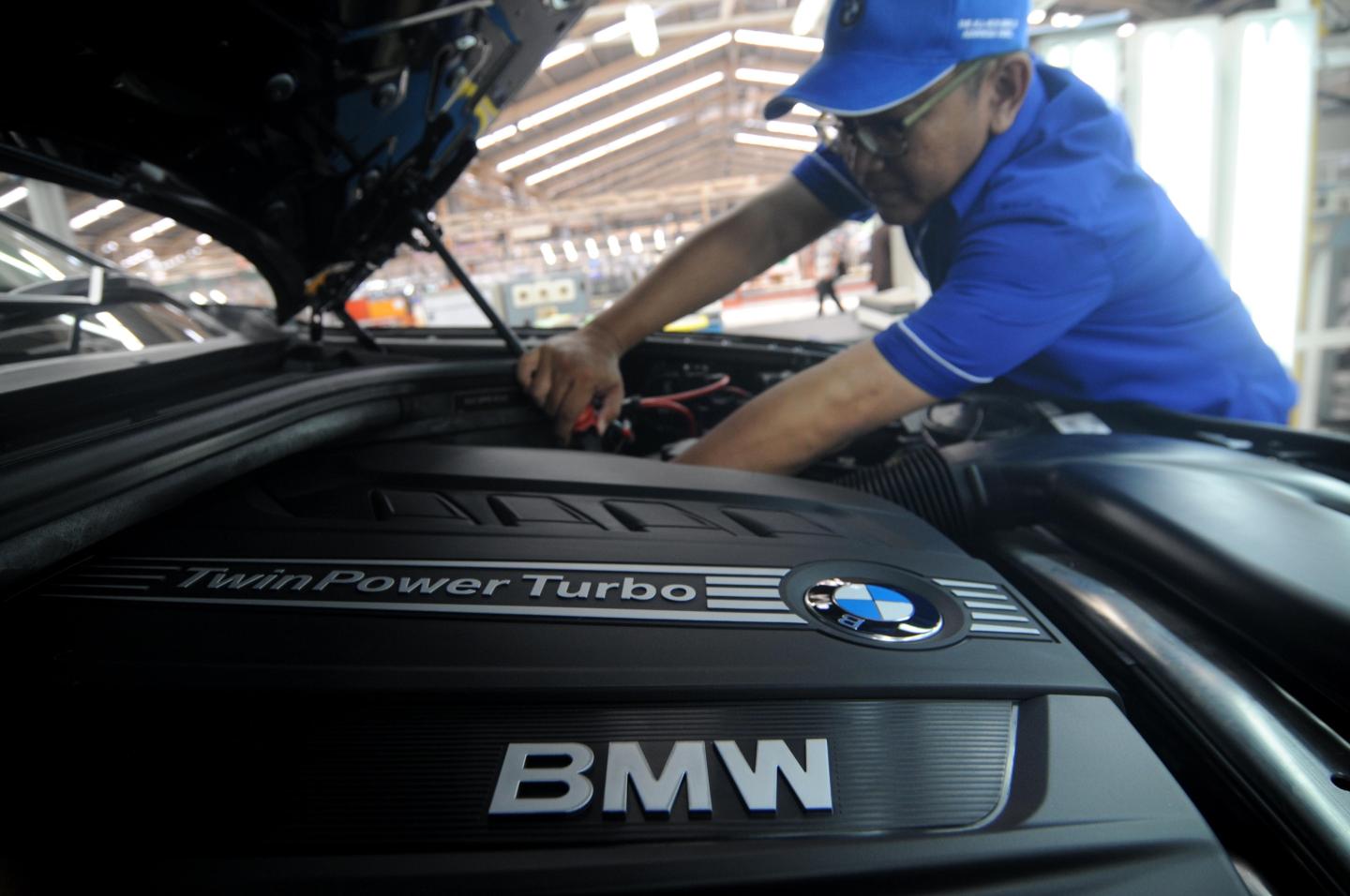 Workers assemble the third generation of BMW X5 Advance Diesel automobile in Jakarta, Indonesia, on April 10, 2015.