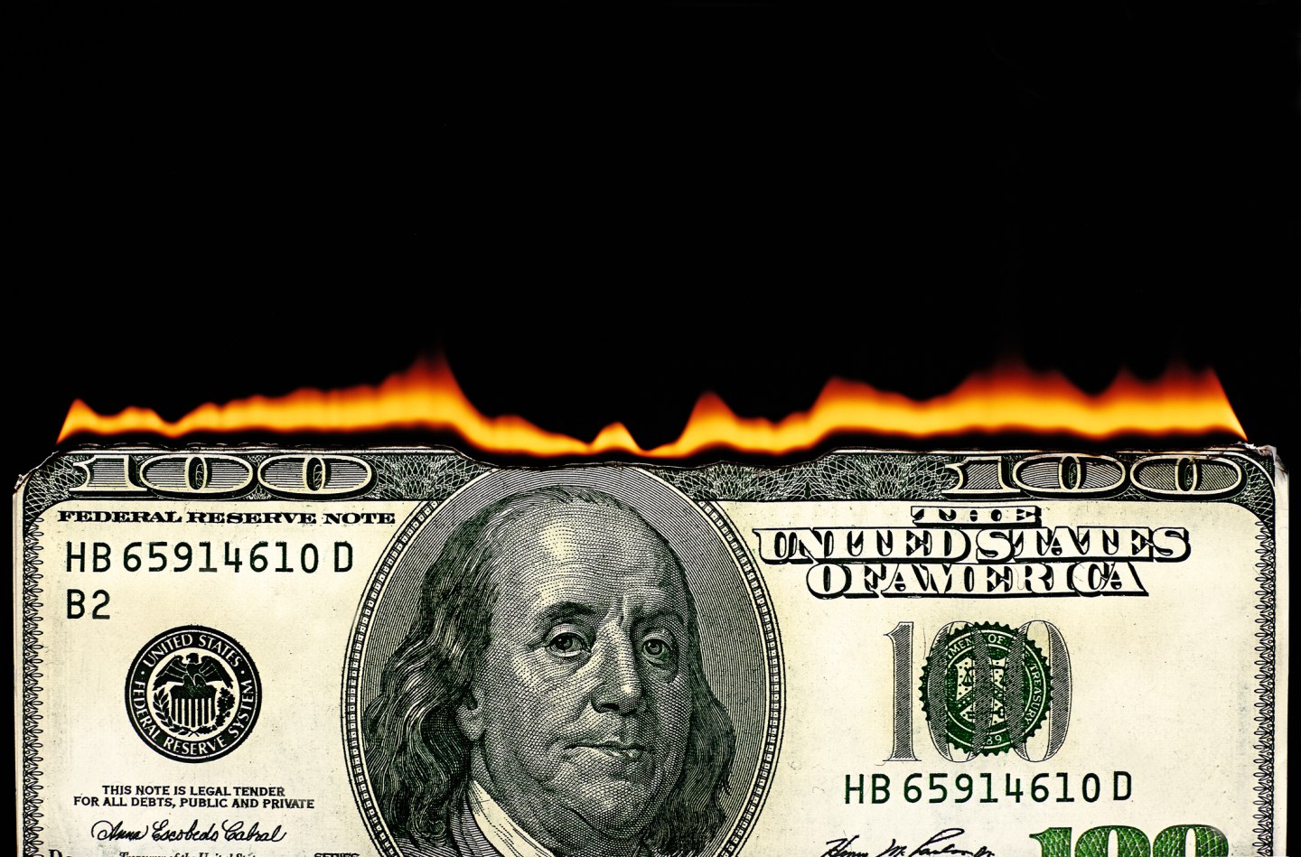 100 dollar bill on fire