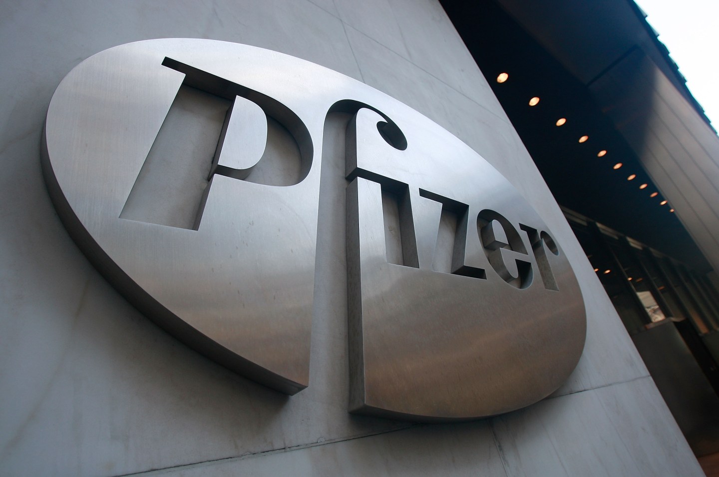 A Pfizer sign hangs on the outside of their headquarters in New York City.