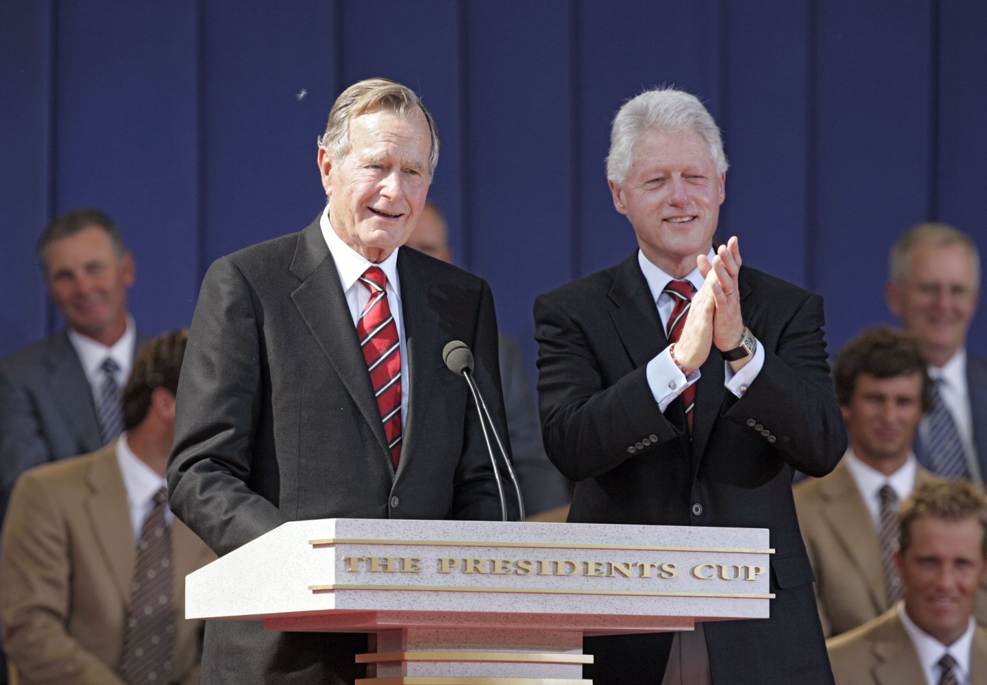 Former United States Presidents George H.W. Bush and Bill Clinton during the opening ceremony of The Presidents Cup at Robert Trent Jones Golf Club in Prince William County, Virginia on September 22, 2005.