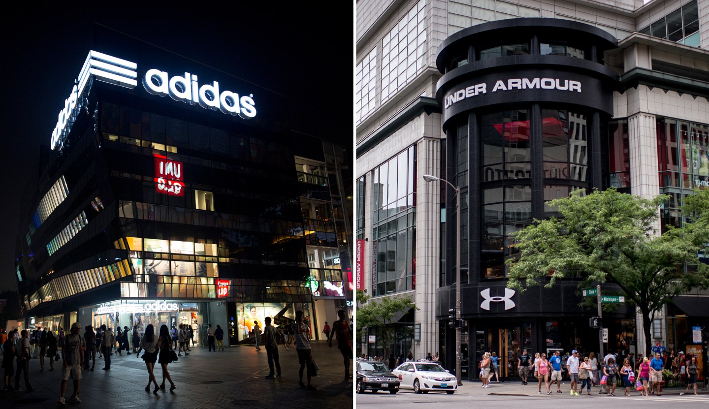 Pedestrians walk past an Adidas AG store in the Sanlitun area of Beijing, China, on Sunday, Sept. 7, 2014. China is scheduled to release figures on consumer and producer prices on Sept. 11. Photographer: Brent Lewin/Bloomberg via Getty Images
Pedestrians walk past an Under Armour Inc. store in Chicago, Illinois, U.S., on Saturday, July 23, 2016. Under Armour is scheduled to release earnings figures on July 26. Photographer: Christopher Dilts/Bloomberg via Getty Images