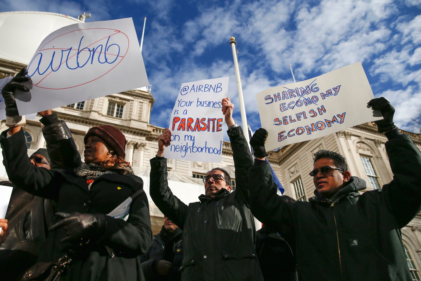 Opponents of Airbnb rally before a hearing called at City Hall in New York
