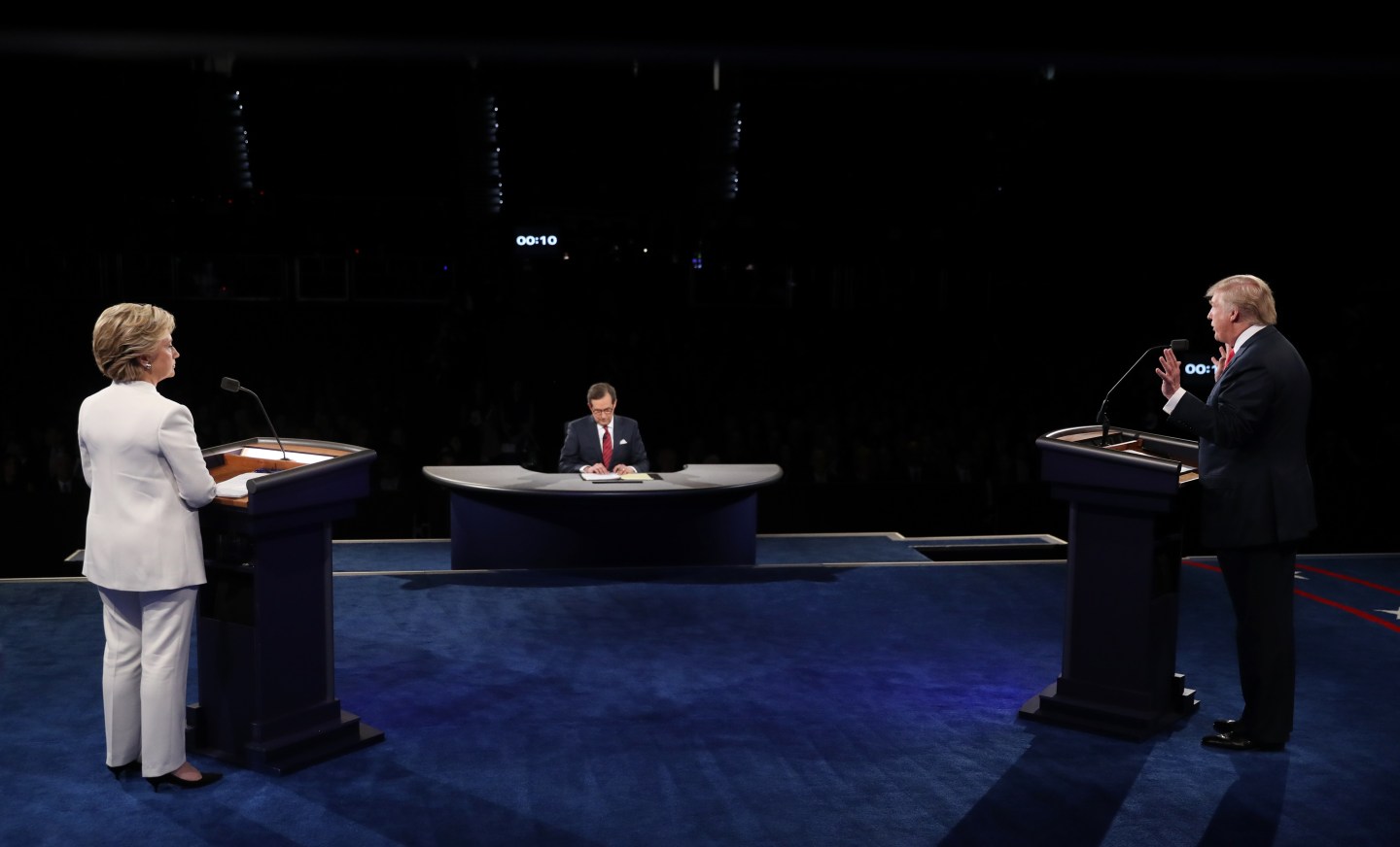 Trump speaks as Clinton listens during their third and final 2016 presidential campaign debate at UNLV in Las Vegas