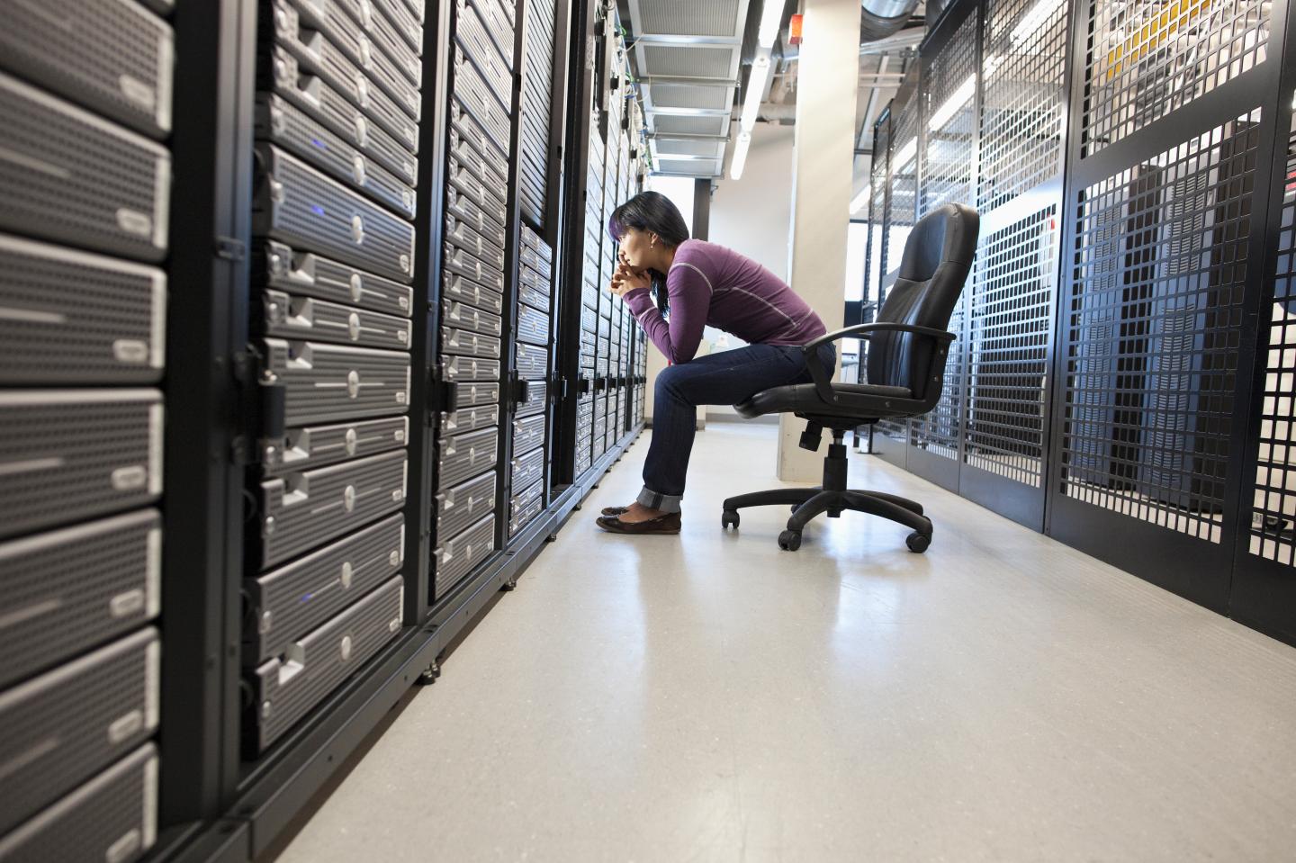 Japanese businesswoman working office technology room