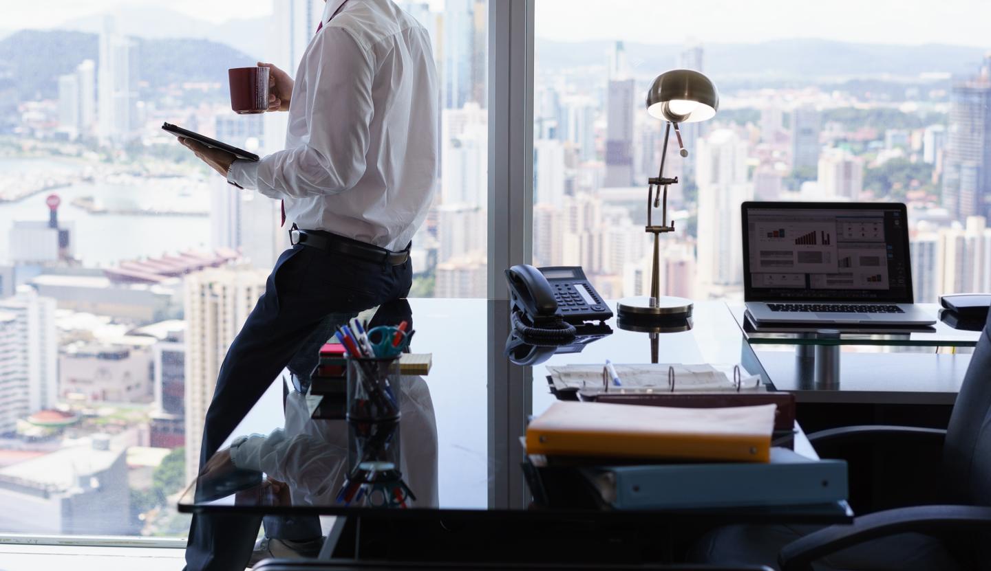 Business Man Reading News Press Review On Tablet PC