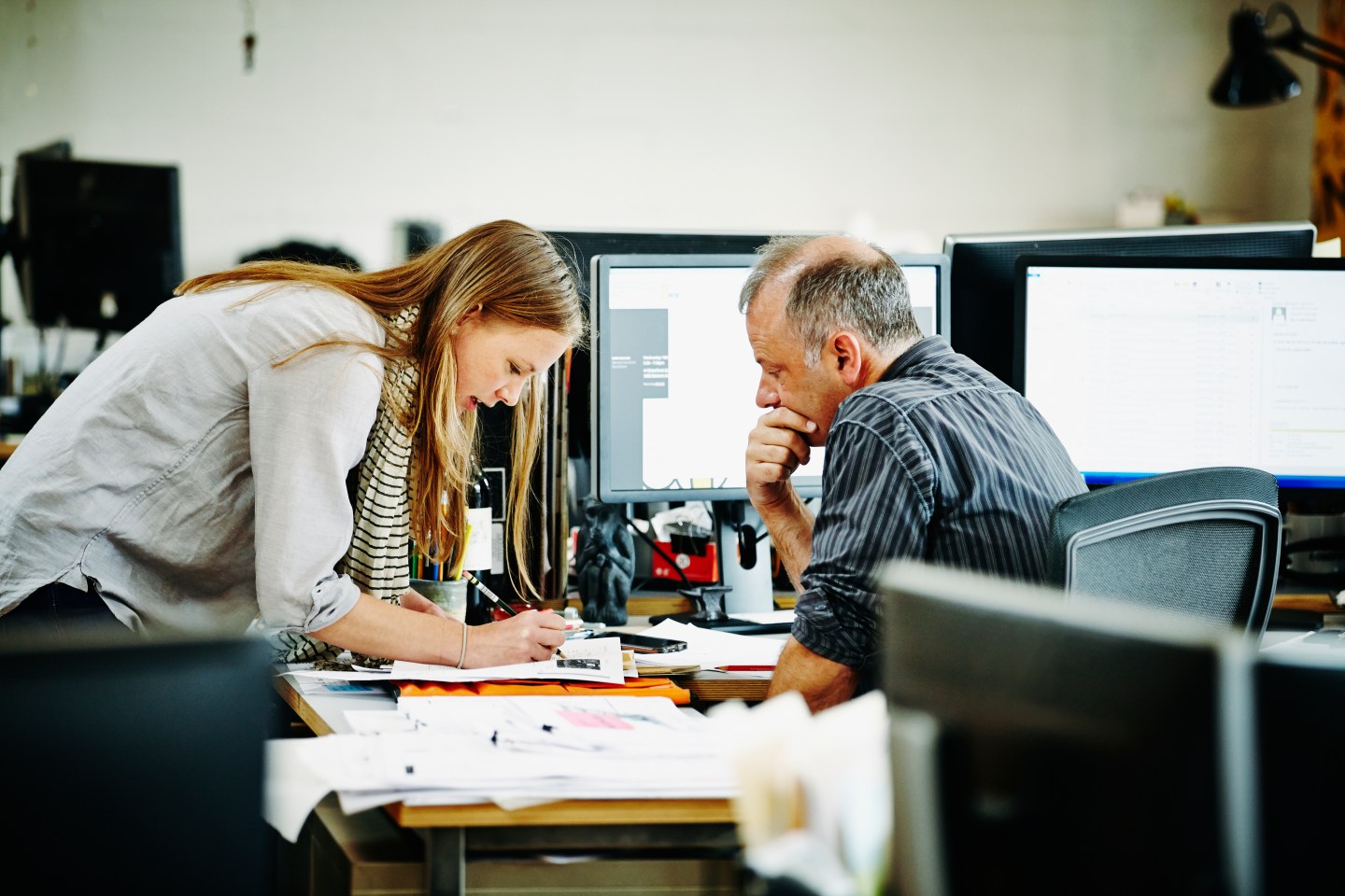 Architect discussing project with coworker