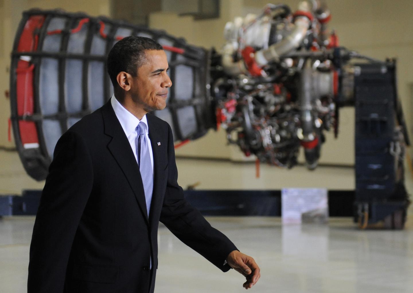US President Barack Obama walks past a m