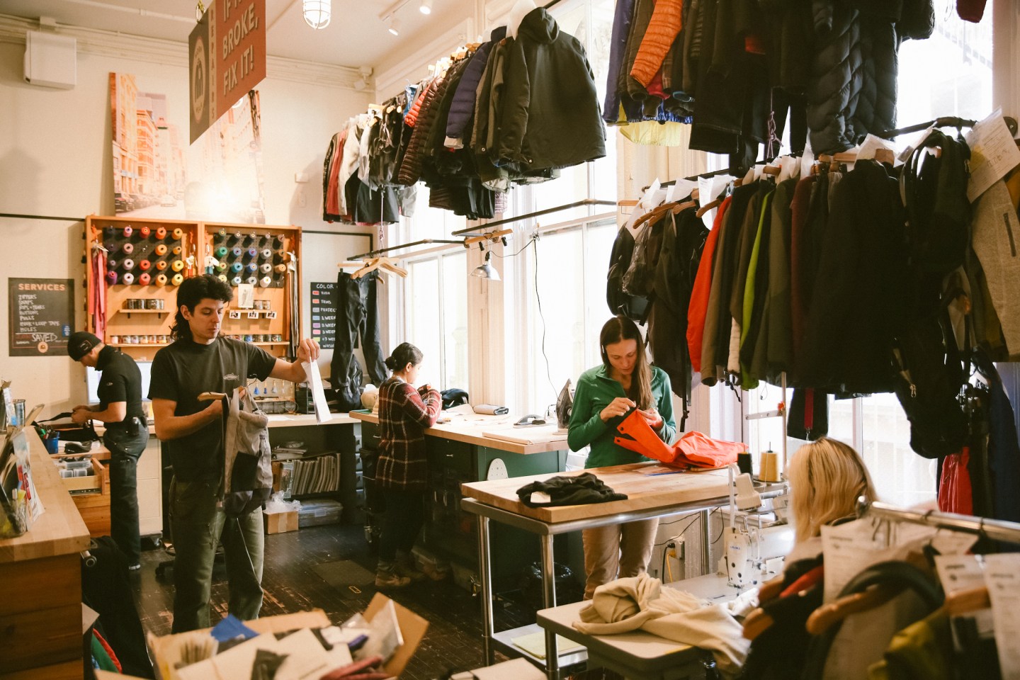 SOHO Patagonia Retail Store Worn Wear Repair Center. All models are Patagonia employees.