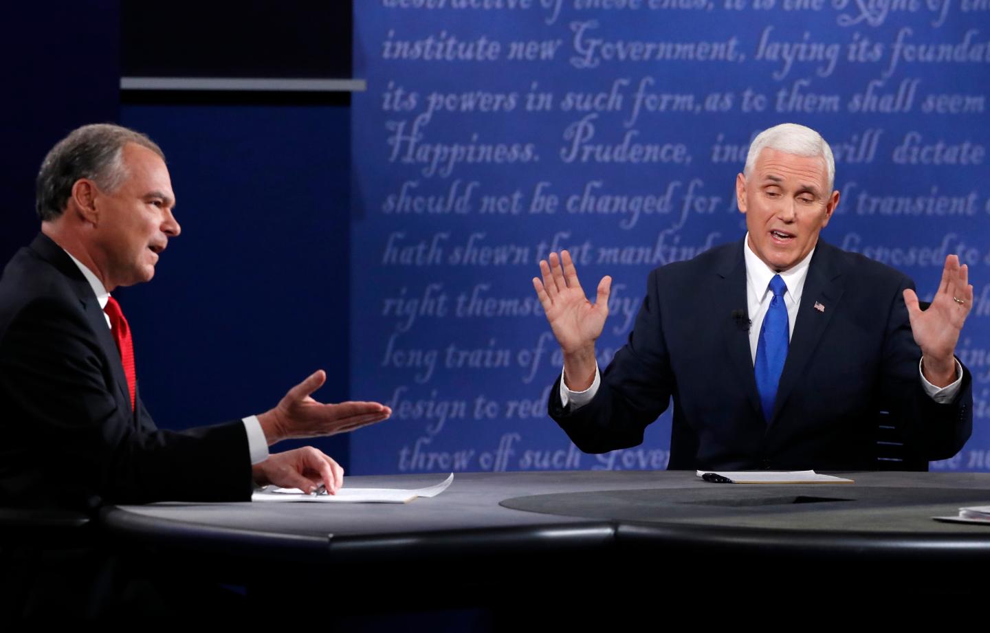 Democratic U.S. vice presidential nominee Senator Kaine and Republican U.S. vice presidential nominee Governor Pence discuss an issue during their vice presidential debate at Longwood University in Farmville