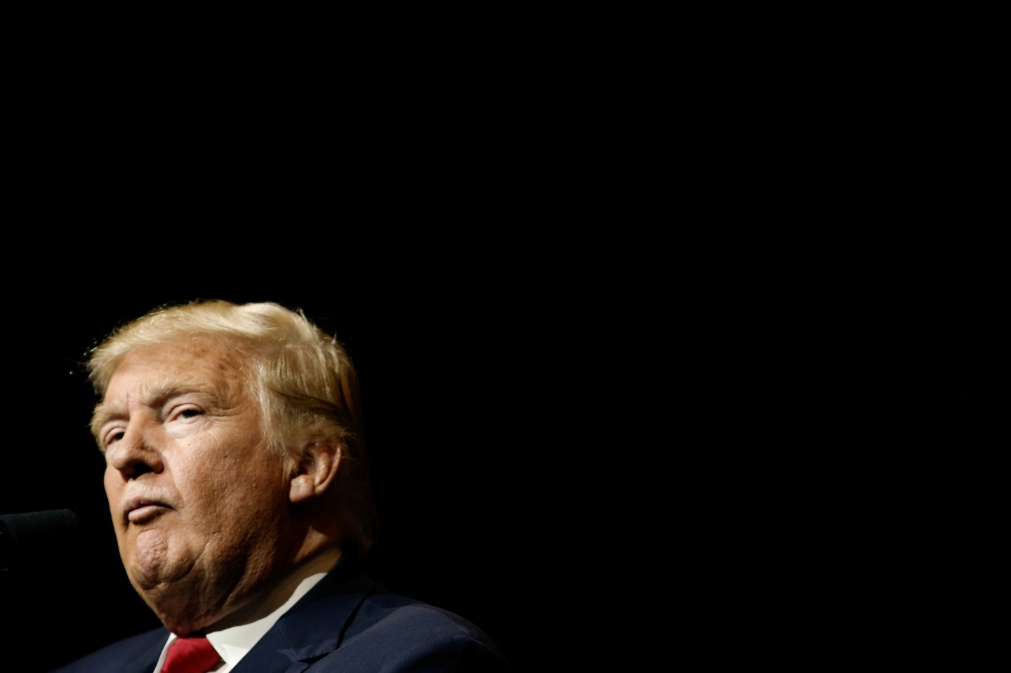 Republican U.S. presidential nominee Donald Trump pauses as he speaks to the audience at a campaign rally in West Palm Beach