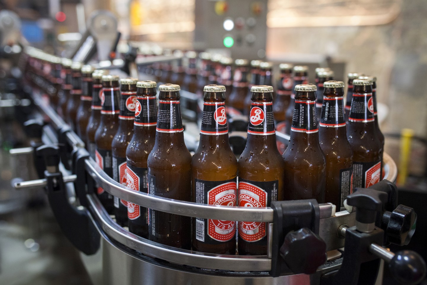Bottled beers move down a bottling line at the Brooklyn Brewery in New York
