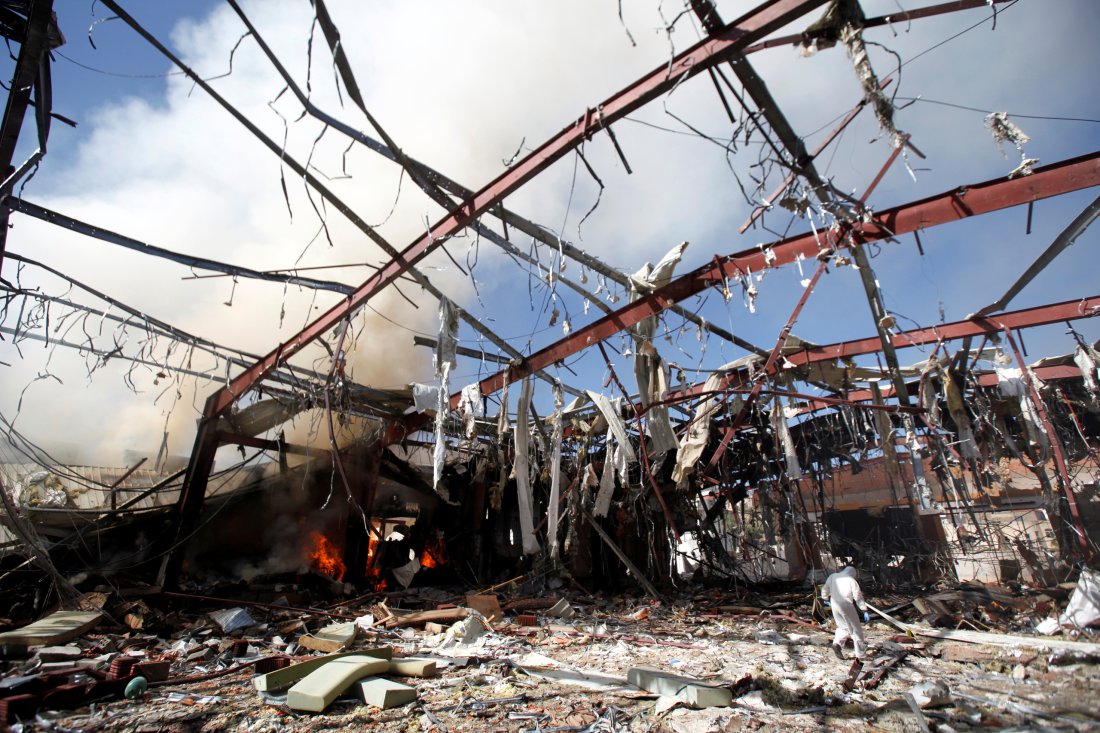 Smoke rises from the community hall where Saudi-led warplanes struck a funeral in Sanaa, the capital of Yemen