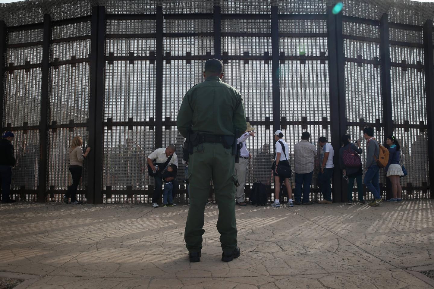 Families Reunite At US-Mexico Border Fence