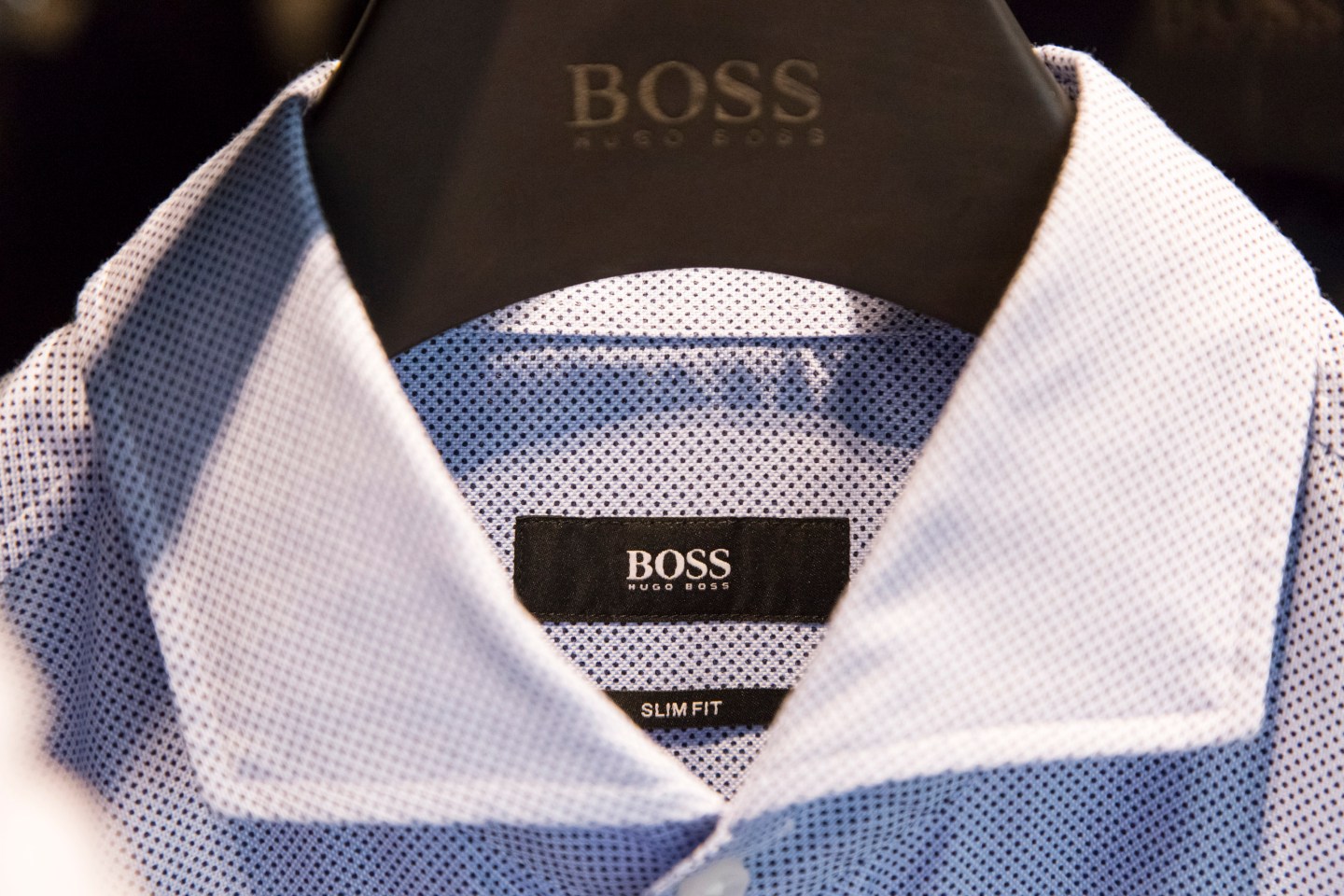 The Hugo Boss logo sits on men's shirt inside the Hugo Boss AG showroom in Metzingen, Germany.
