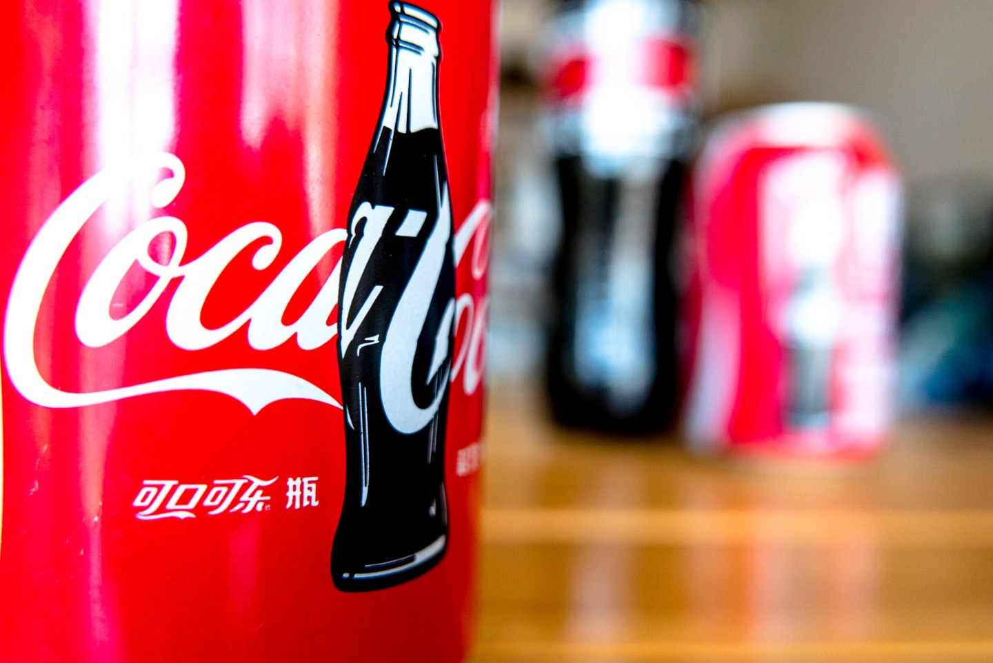 Logo of Coca-Cola on a bottle. The strong dollar hit Coca-