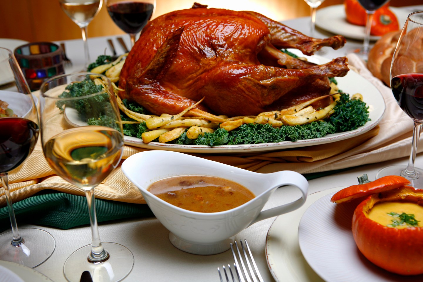 Saltrubbed, roasted turkey with roasted parsnips, pan sauce, center and spiced pumpkin soup with m
