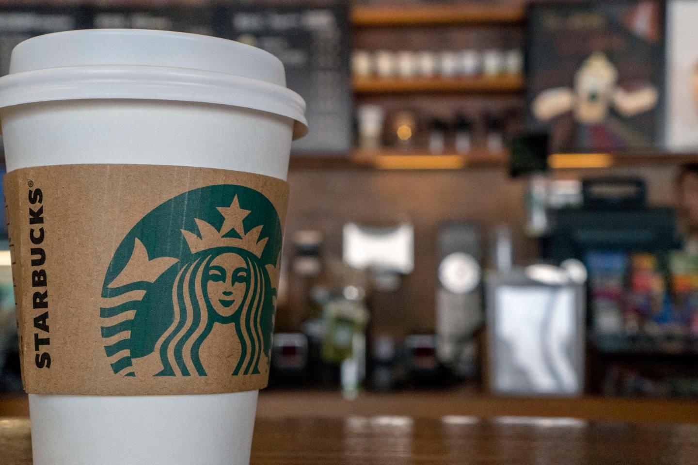 Paper cup in a Starbucks coffee shop.