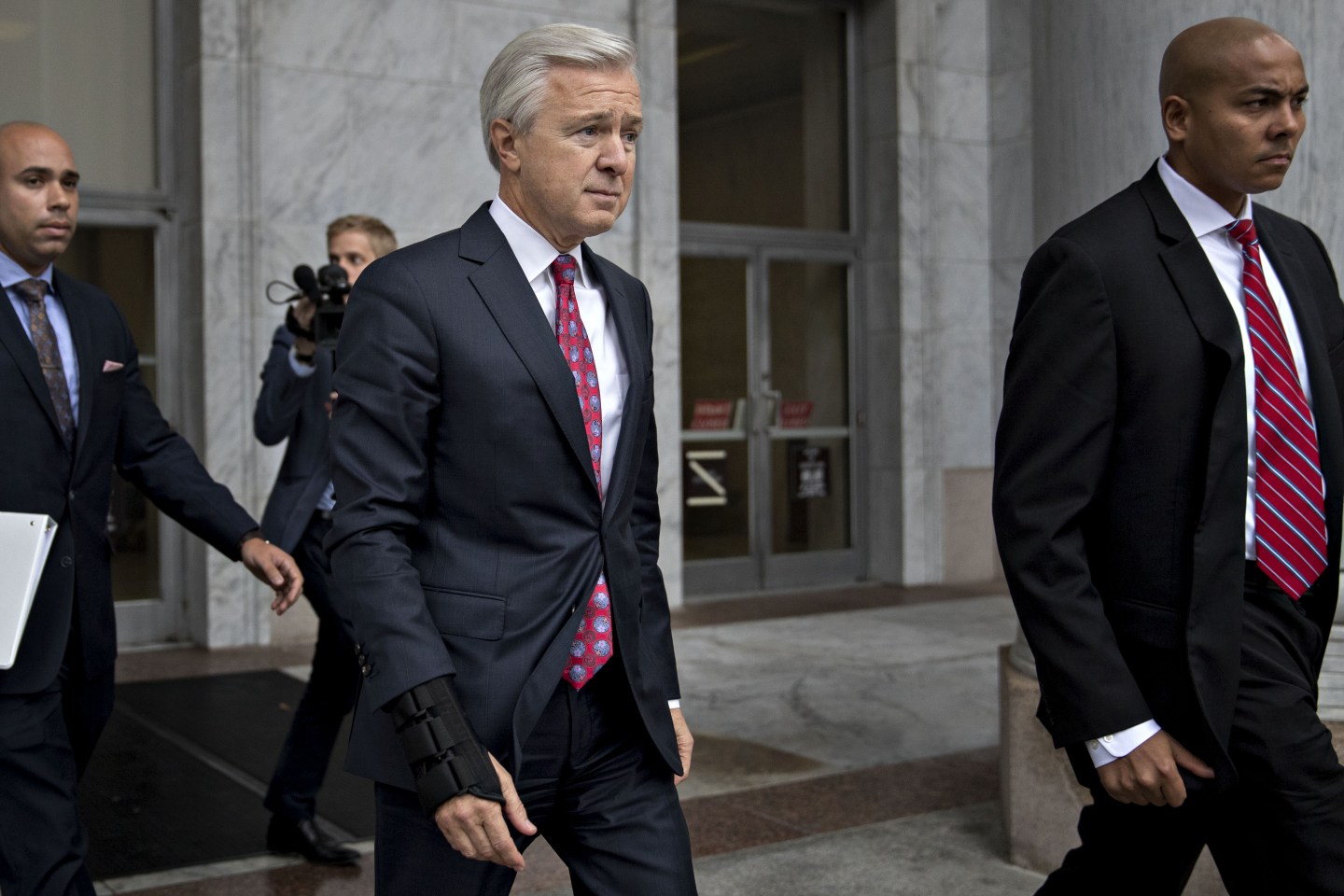 Former Wells Fargo CEO John Stumpf exits the Rayburn House Office building after a House Financial Services Committee hearing in Washington, D.C.