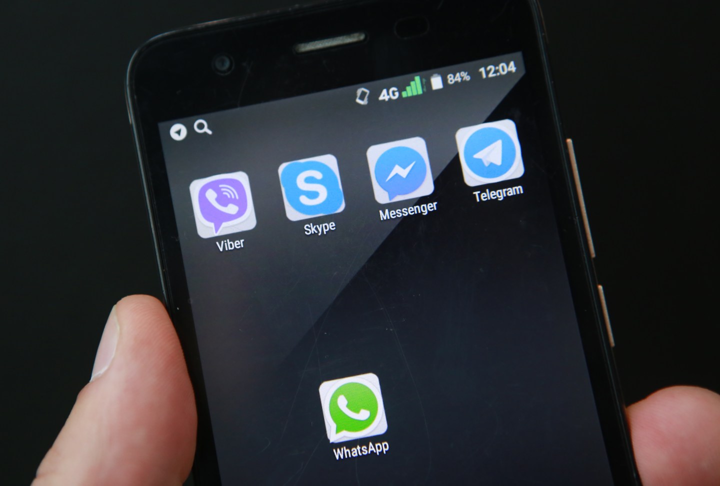 The WhatsApp, Viber, Skype, Facebook Messenger and Telegram applications icons on a smartphone screen.