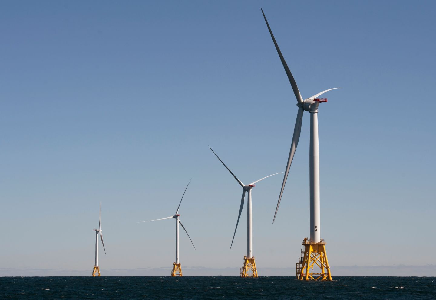 Wind turbines, of the Block Island Wind Farm, tower above the water on October 14, 2016 off the shores of Block Island, Rhode Island.