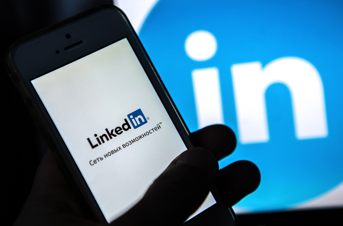 A mobile phone screen showing the logo of LinkedIn.