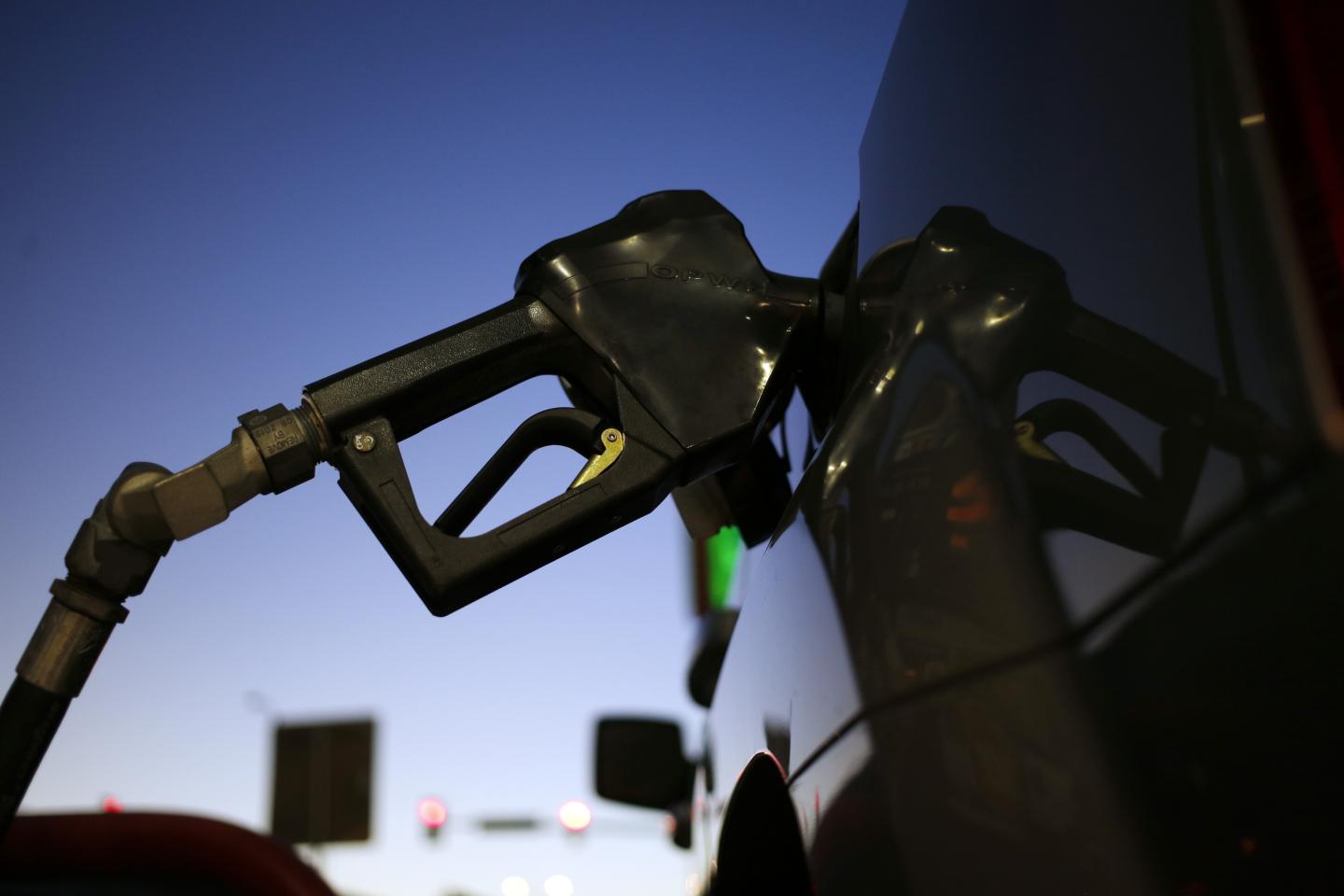 A fuel pump sits in the tank of a vehicle at a ConocoPhillips gas station in Texas.