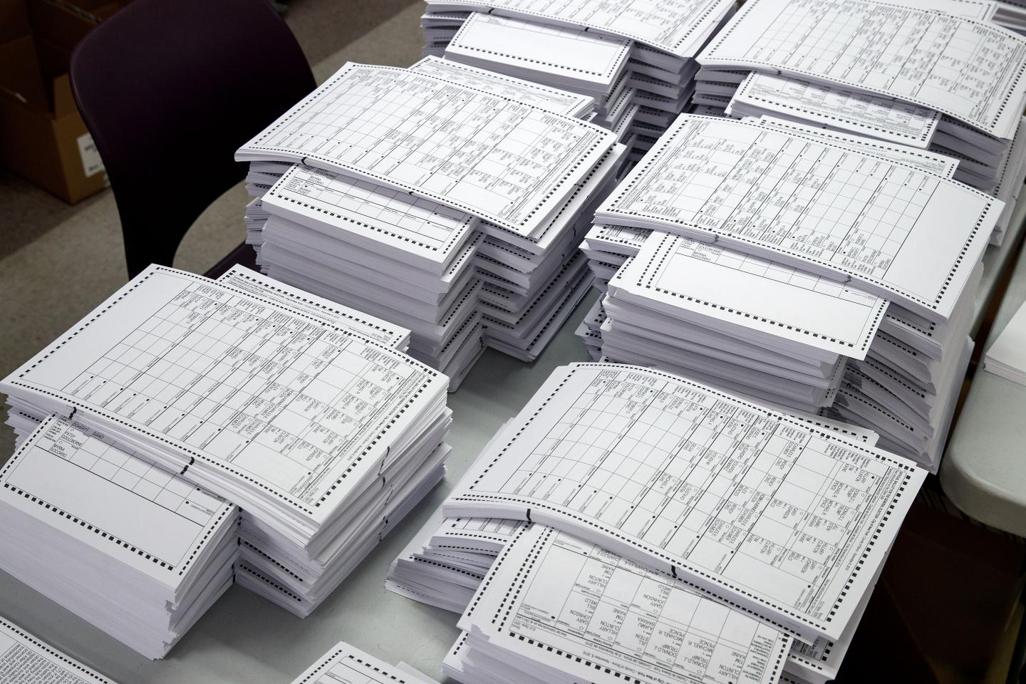 Test ballots wait to be scanned at a Board of Elections Elections voting machine facility warehouse, November 3, 2016 in the Bronx borough in New York City.
