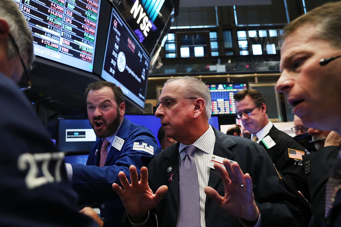 Traders work on the floor of the New York Stock Exchange (NYSE) the morning after Donald Trump won the presidential election on November 9, 2016.