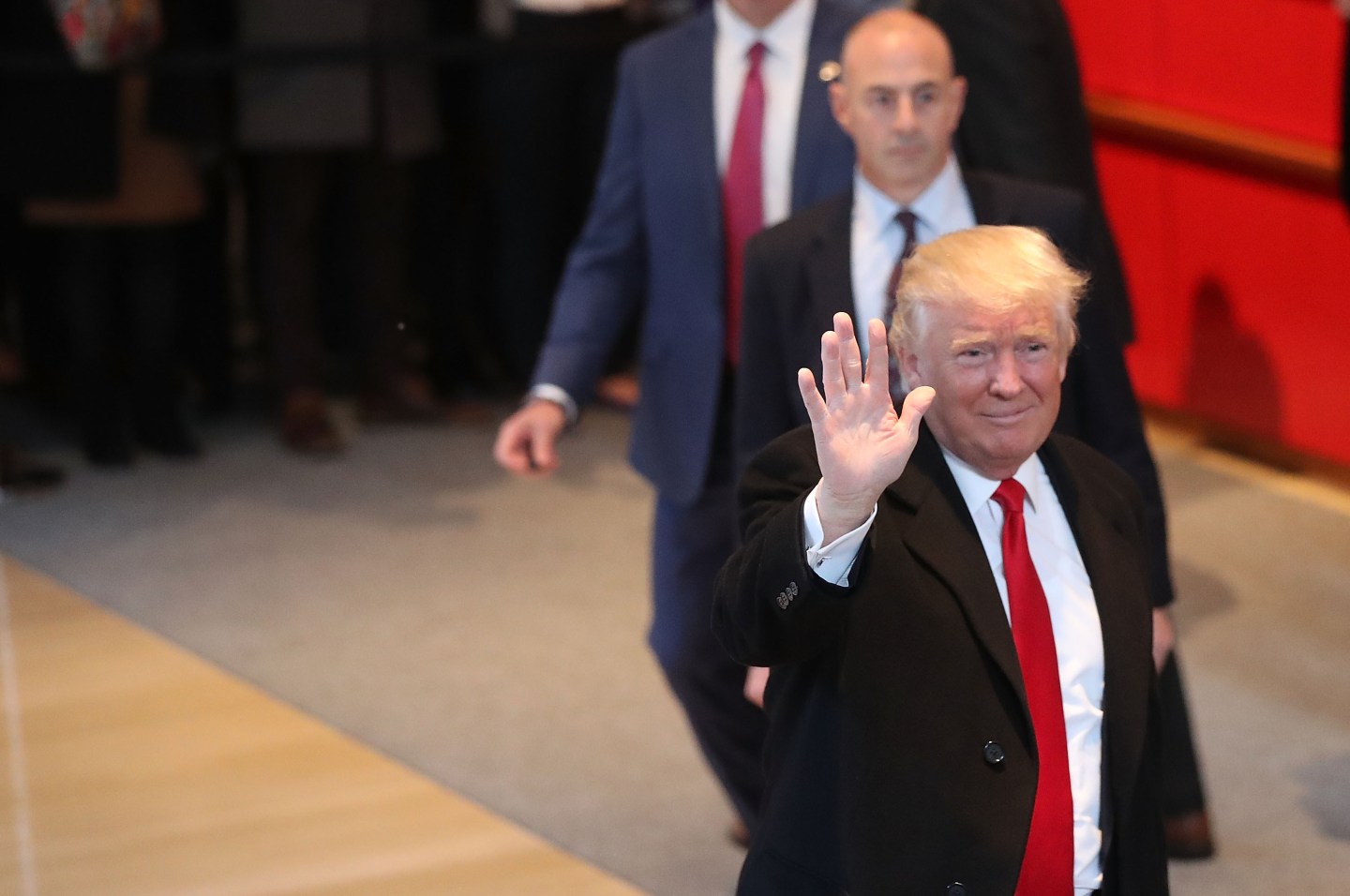 President-elect Donald Trump walks through the lobby of the New York Times on November 22, 2016.