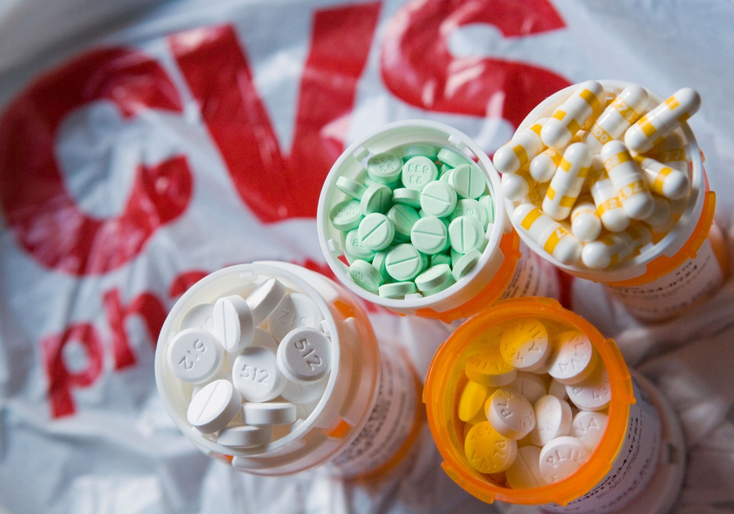 Prescription medication frames the CVS logo.