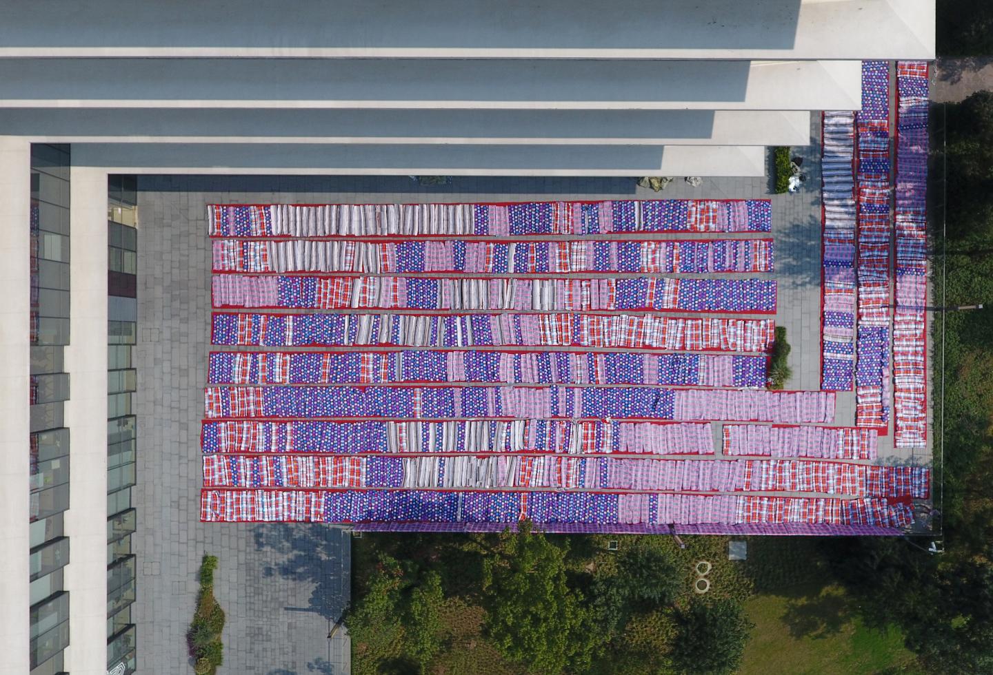 Quilts for Alibaba Group's employees to rest as they prepare for the upcoming 11.11 global shopping festival, also called Singles' Day shopping festival, are dried in a yard of Xixi campus of Alibaba Group in Hangzhou