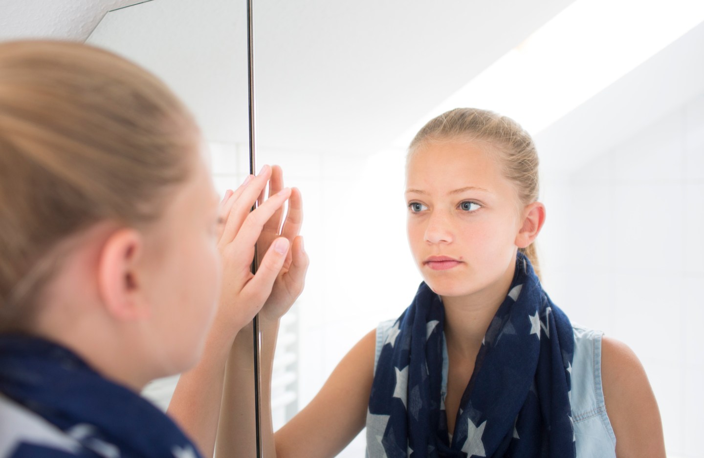 Teenager In Front Of A Mirror