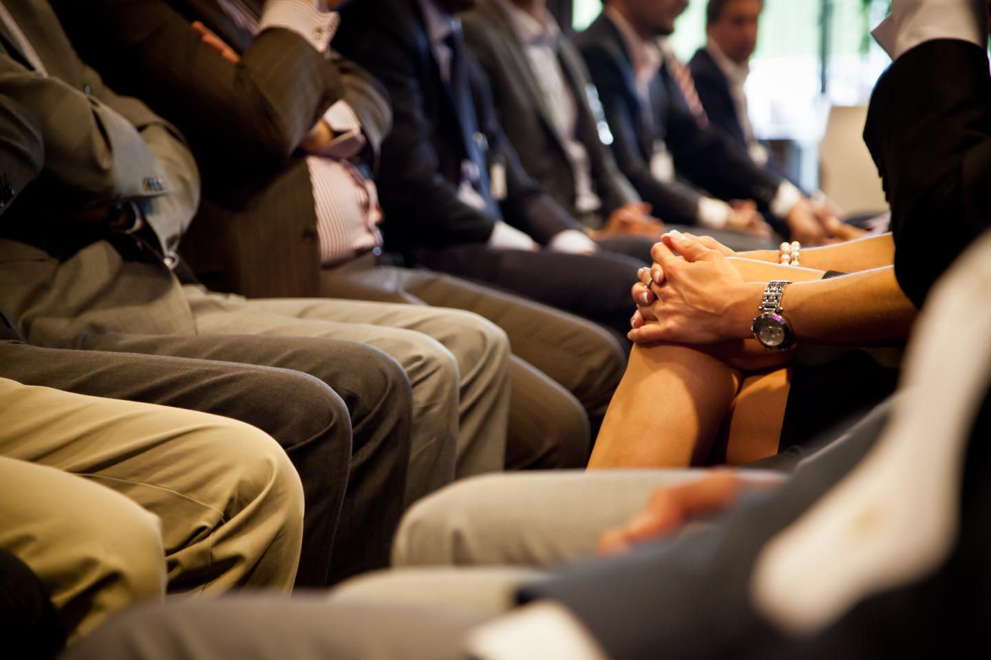 Midsection Of Business People During Meeting In Office