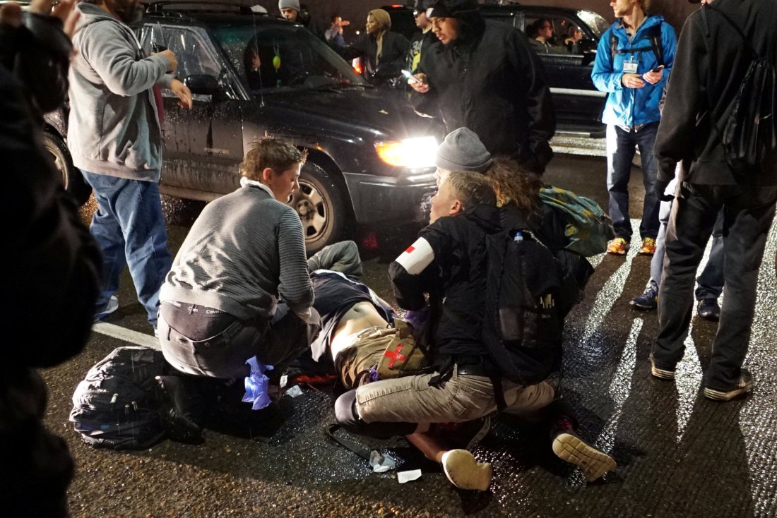 A demonstrator is treated for a gunshot wound during a protest against the election of Republican Donald Trump as President of the United States in Portland, Oregon