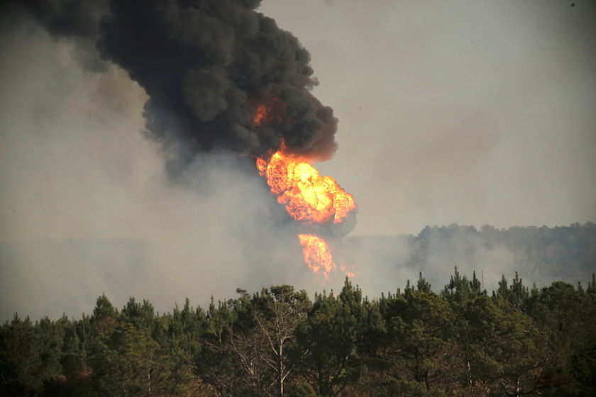 Flames shoot into the sky from a gas line explosion in western Shelby County