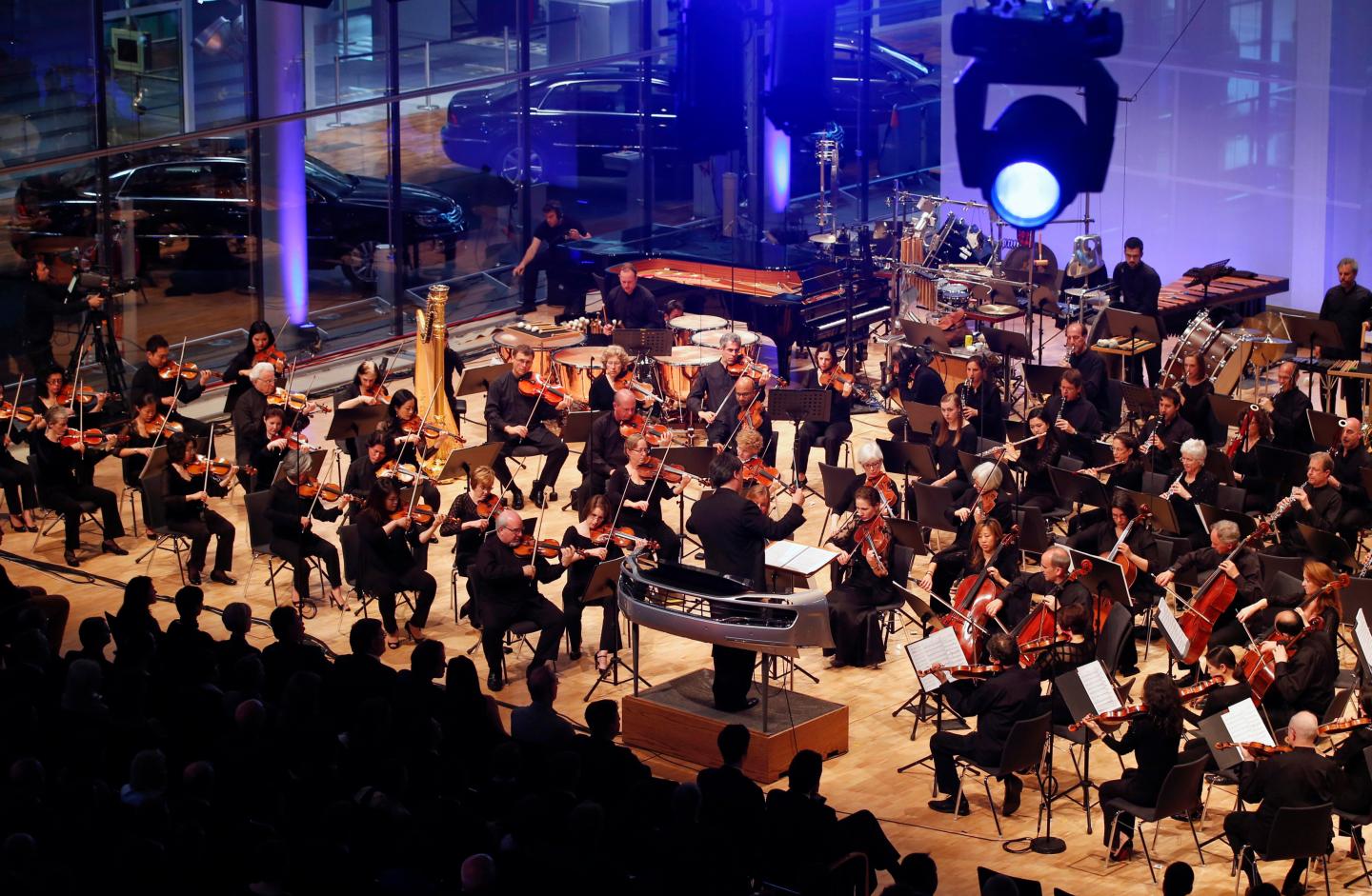 Gilbert, chief conductor of New York Philharmonic, leads a performance of the composition 'Kraft' inside the Glaeserne Manufaktur in Dresden