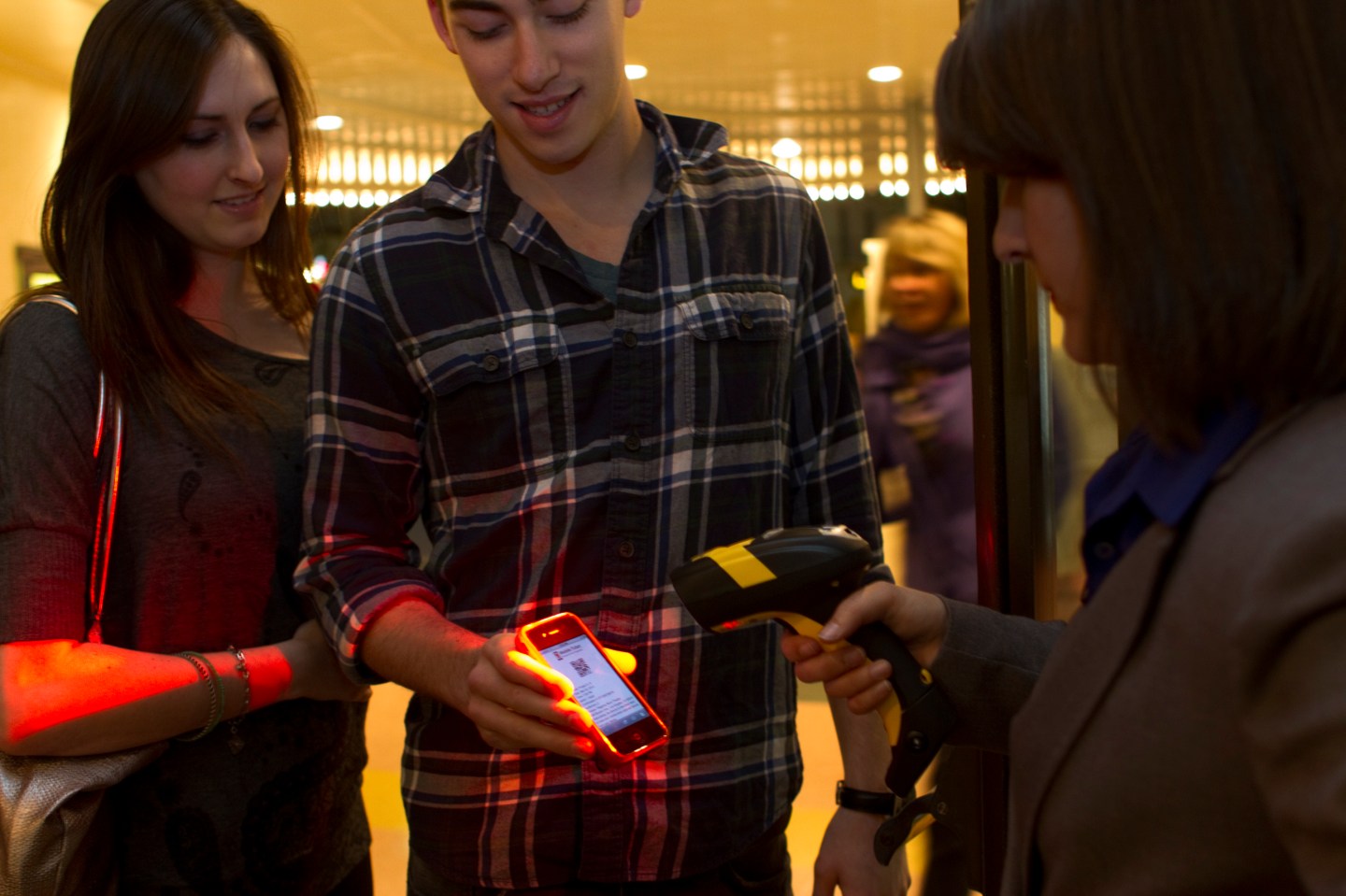 UCLA students try out Fandango's Mobile Ticket system at the Bruin Theater in Westwood Village.